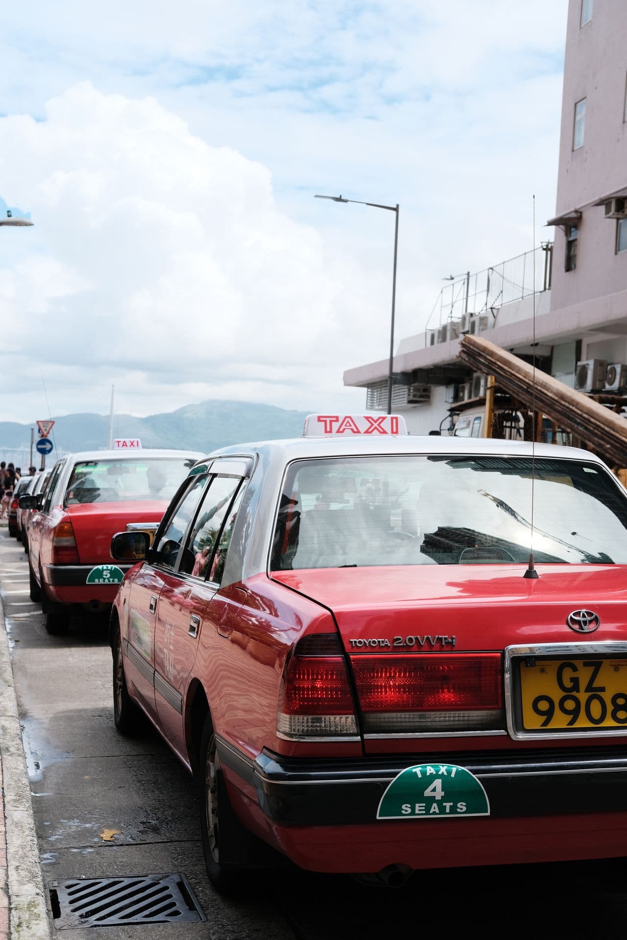 Taxis waiting along a city street
